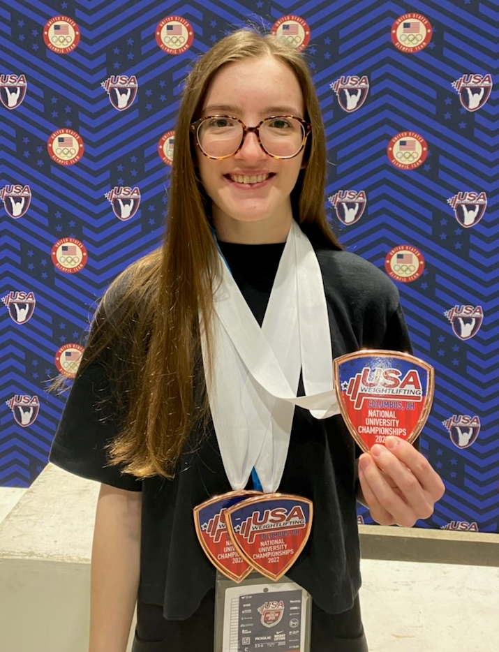 Amanda Serapiglia holding medals