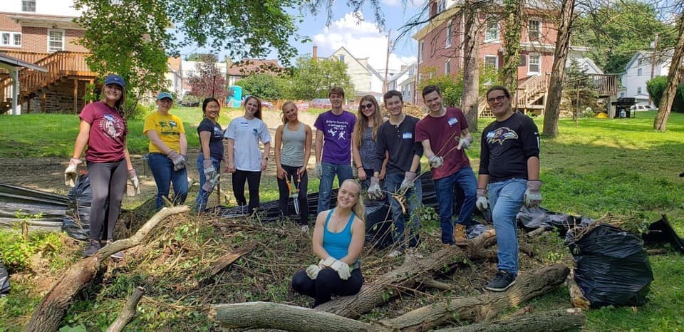 Aubrey Marquis (center) with a group of volunteers at a clean-up event at Coulter Park in Greensburg