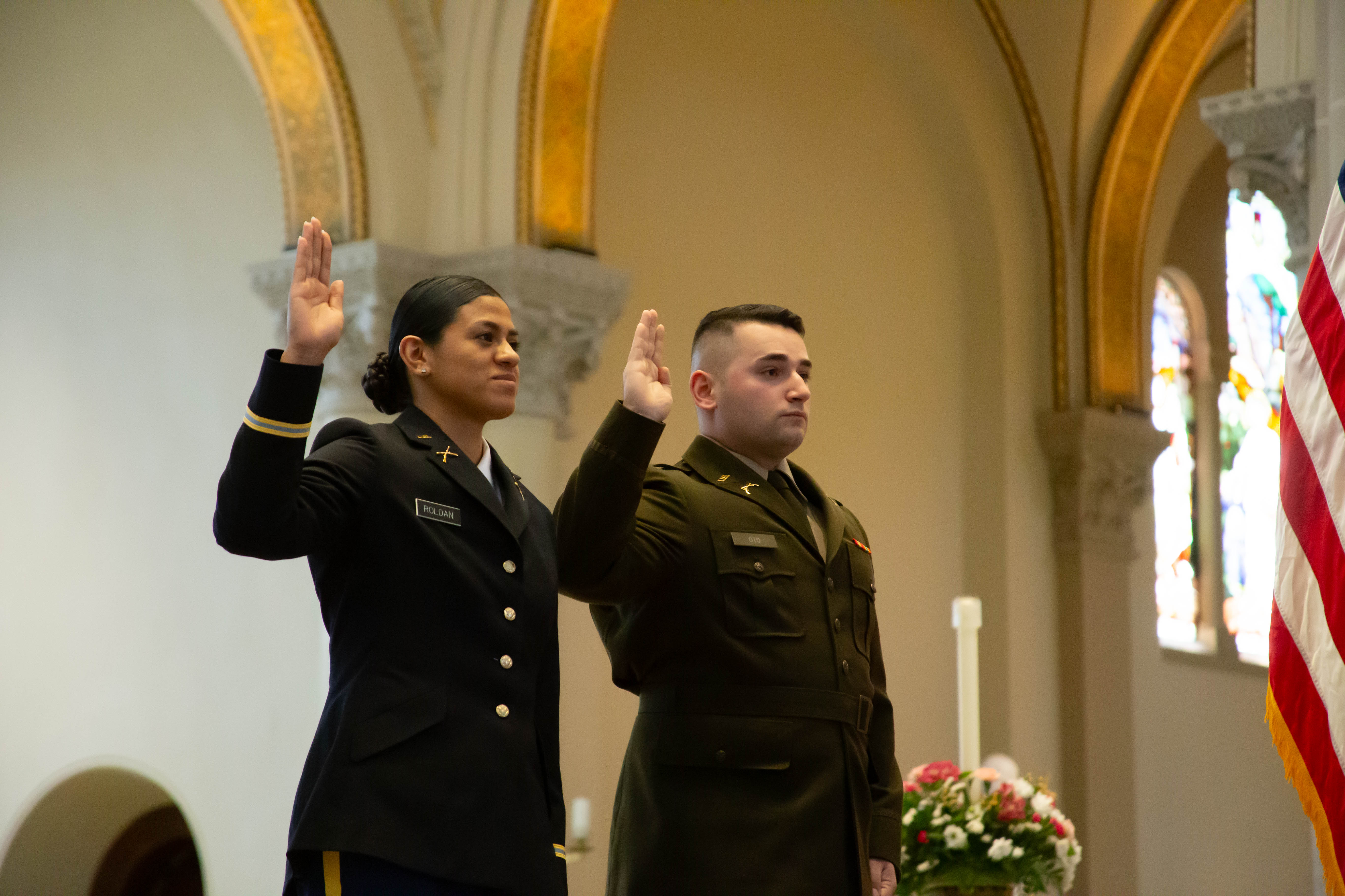 2nd Lt. Riley Roldan (left) and 2nd Lt. Dominic Oto take the Oath of Commissioned Officers