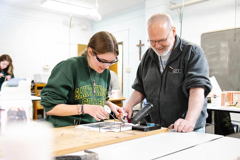 Saint Vincent College classroom Student wearing safety glasses engaged in a classroom activity.