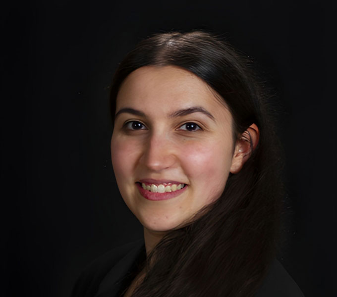 Studio Portrait of Dr. Rachel Patton against a black background.